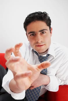 Portrait of a businessman with his hand out