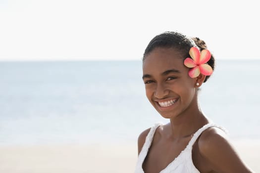 Portrait of a woman smiling on the beach