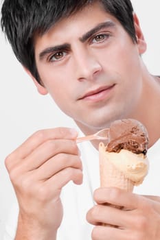 Close_up of a man eating an ice cream