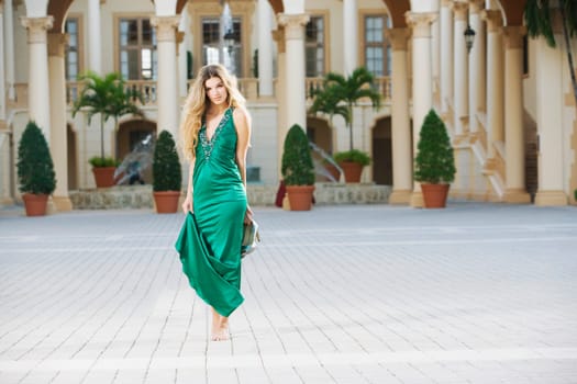 Woman standing in front of a hotel, Biltmore Hotel, Coral Gables, Florida, USA
