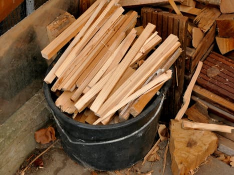 firewood, spatula in a bucket