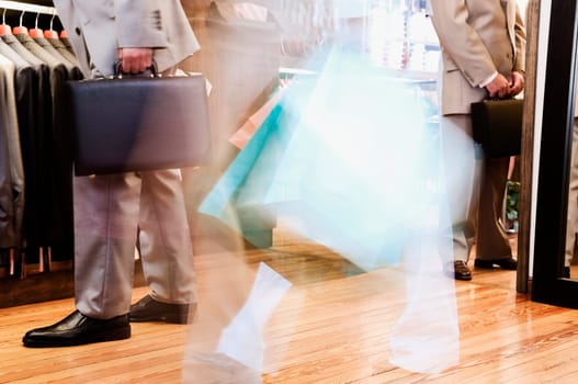 Businessman and a woman shopping in a clothing store