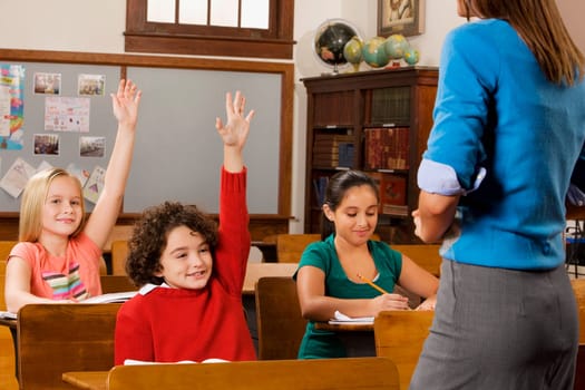 Students with their teacher in a classroom