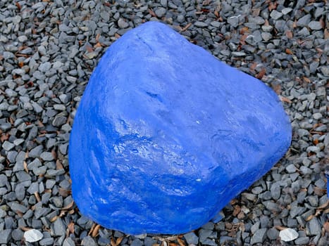 blue stone in a garden on grit