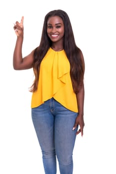A beautiful african woman pointing to something, isolated over a white background