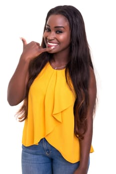 Happy young african woman student making "call me"" sign with hand"