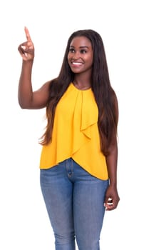 A beautiful african woman pointing to something, isolated over a white background