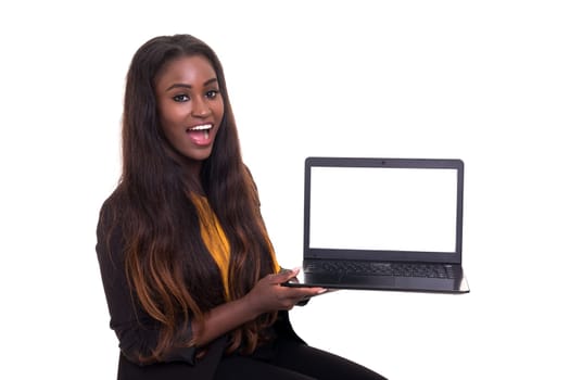 Young african woman presenting your product on a laptop computer