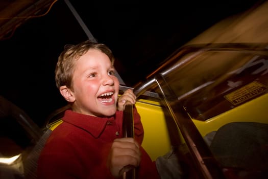Boy riding on a carousel