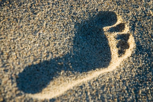 High angle view of a footprint on the beach