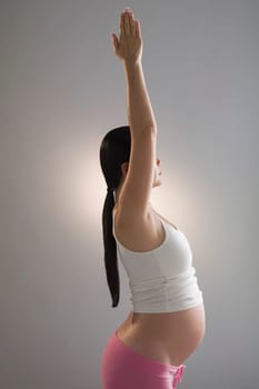 Pregnant woman practicing yoga
