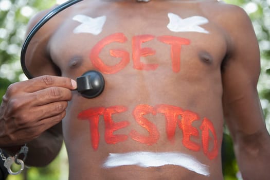 Gay man examining himself with a stethoscope, Washington DC, USA