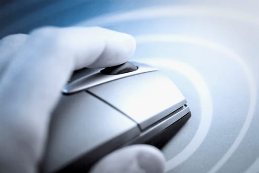 Close_up of a human hand holding a computer mouse