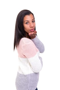 Beautiful african young woman blowing you a kiss, isolated over white