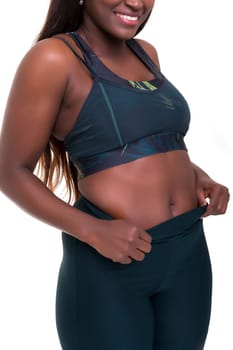 Beautiful large african woman doing exercise - Isolated over white