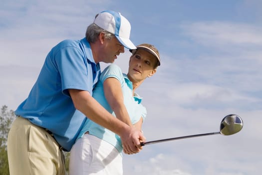 Golf instructor teaching golf to a woman, Biltmore Golf Course, Coral Gables, Florida, USA