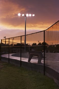 Chainlink fence with a floodlight in a stadium