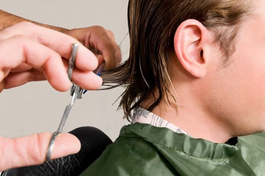 Man receiving a haircut in a salon