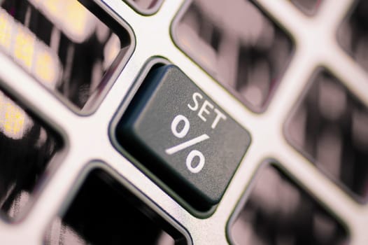 Close_up of percentage sign on a calculator