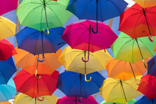 Lots of umbrellas coloring the sky in the city of Agueda, Portugal