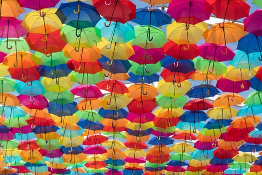 Lots of umbrellas coloring the sky in the city of Agueda, Portugal