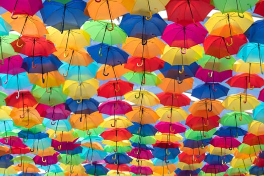 Lots of umbrellas coloring the sky in the city of Agueda, Portugal