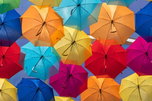 Lots of umbrellas coloring the sky in the city of Agueda, Portugal