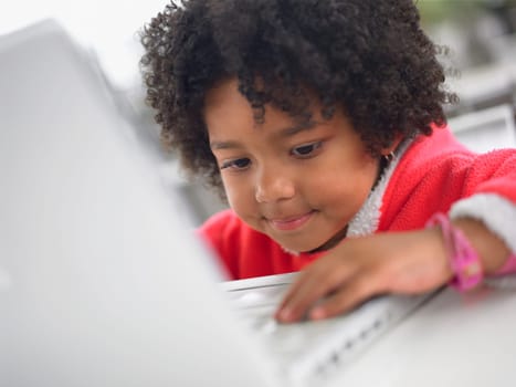 Close_up of a girl using a laptop