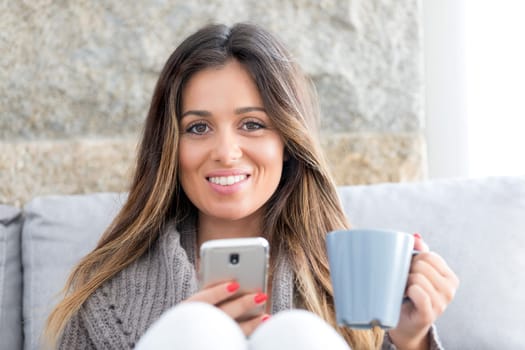 Beautiful young woman relaxing at the phone