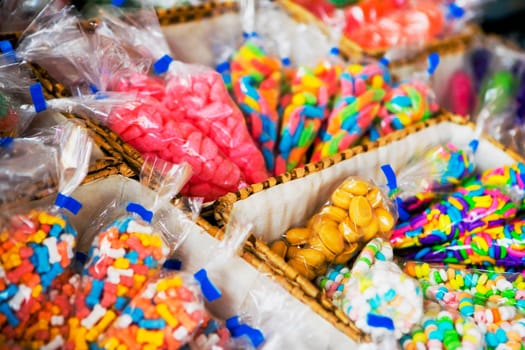 Close_up of assorted candy in plastic bags