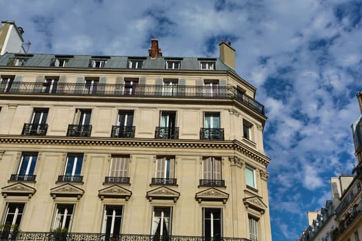 Facade of a traditional living building in Paris, France