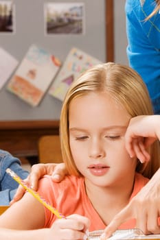 Schoolgirl studying in a classroom
