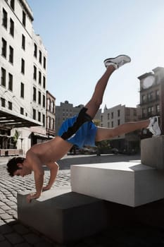 Man exercising on stones