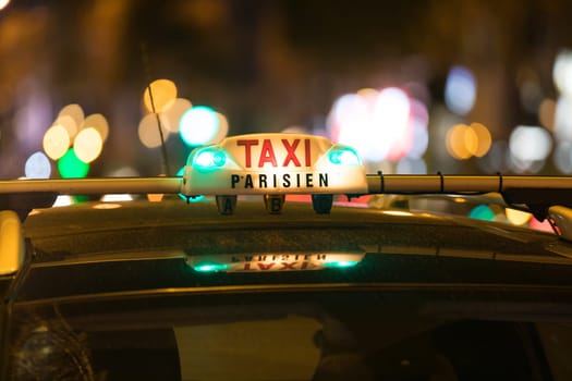 French taxi with the champs elysees avenue in background