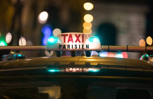 French taxi with the champs elysees avenue in background