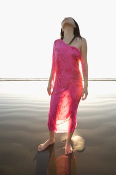 Woman standing on the beach