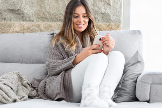 Beautiful young woman relaxing at the phone