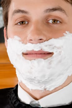 Man getting shaved in a salon