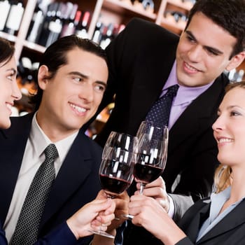 Business executives toasting with wine