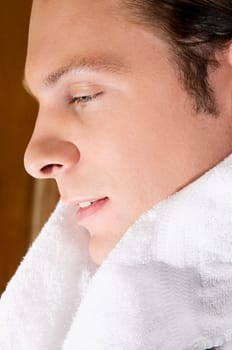 Man with a towel around his shoulders