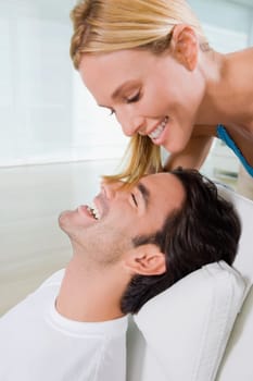 Close_up of a young man and a mid adult woman smiling