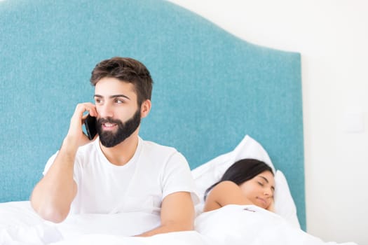 Young depressed couple in bed - daylife problems concept