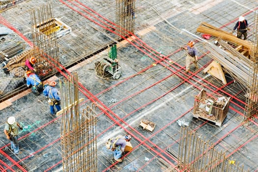 High angle view of a group of construction workers working at a construction site