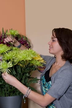 Sales clerk arranging flowers in a store, Miami, Florida, USA