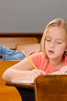 Schoolgirl studying in a classroom