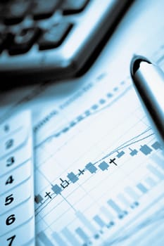Pen and calculator on a graph