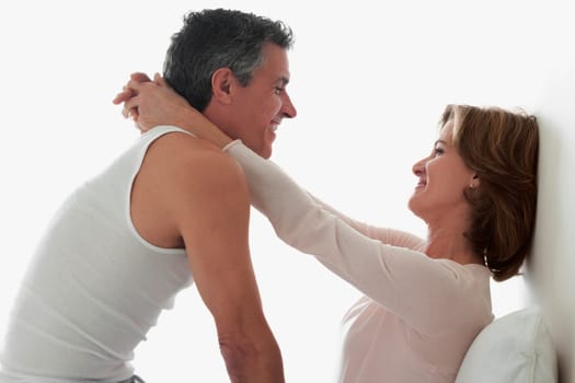 Couple romancing in the bedroom
