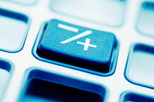 Close_up of the Plus_Minus button of a calculator
