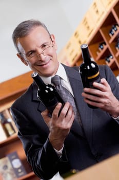 Businessman holding wine bottles
