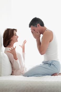 Woman arguing with a man in the bedroom